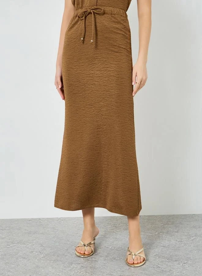Styli Women Beige Textured Straight Maxi Skirt